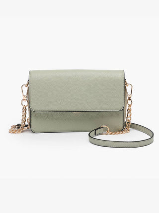 Light sage green leather crossbody handbag with gold chain strap and structured flap design.