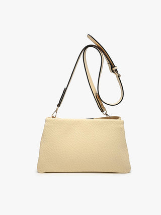 Butter Yellow woven leather shoulder bag with adjustable strap and minimalist rectangular silhouette.