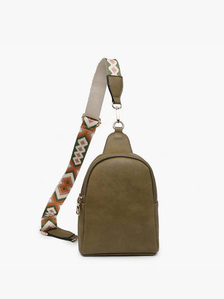 Olive green leather sling backpack purse with patterned adjustable crossbody strap.
