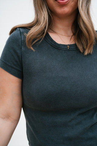 Detail of the ribbed cotton texture and crew neckline on the washed black Atlas Crew Tee