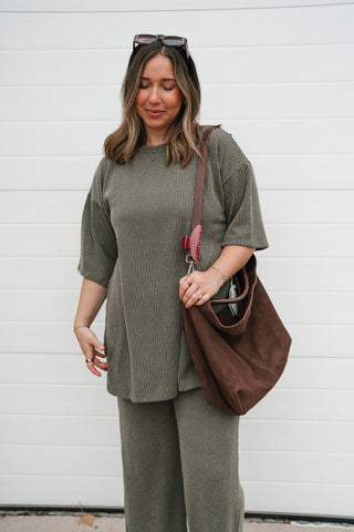 Front view of the olive ribbed set top showing the crew neckline and relaxed drape
