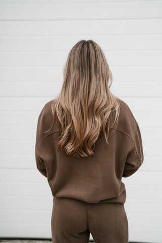 Back view of the mocha ribbed crewneck top with drop shoulders and the matching pants