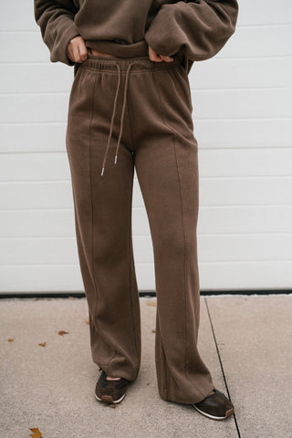 Front view of the mocha ribbed lounge pants showing the drawstring waist and wide straight leg