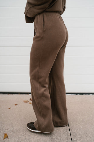 Side back view of the mocha ribbed lounge pants showing the fit through the hip and wide leg