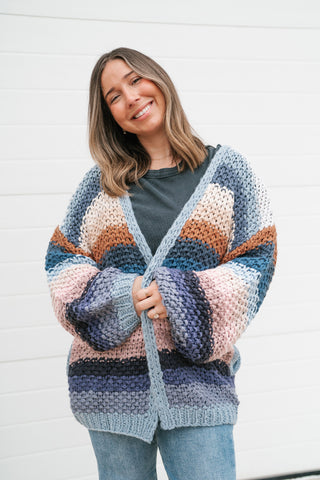 Close-up front view of the oversized striped crochet cardigan with ribbed front band and balloon sleeves