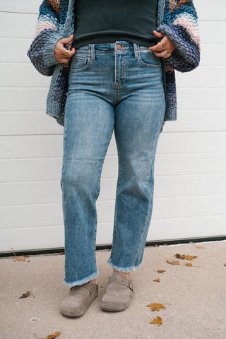 Close-up front view of the Risen Avery high rise medium wash straight jeans