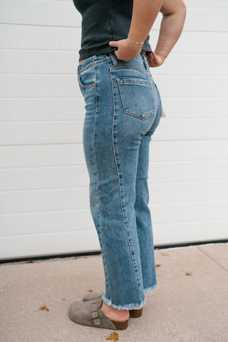 Side view of the Risen Avery jeans showing the side seam detail and straight ankle-length leg