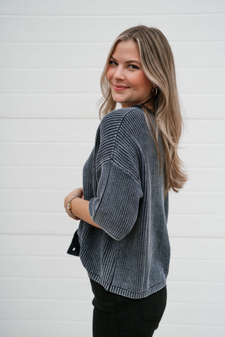 Side view of the Better Days navy ribbed knit cardigan showing the boxy shape