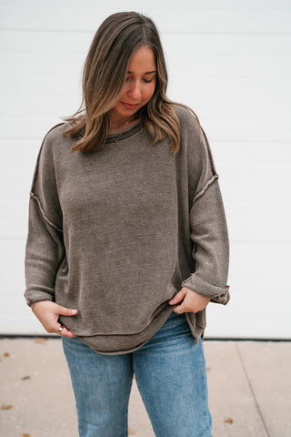 Front view of the brown dolman sleeve sweater with drop shoulders and cuffed three-quarter sleeves