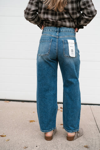 Back view of the Risen Peyton medium wash slouchy cropped barrel jeans