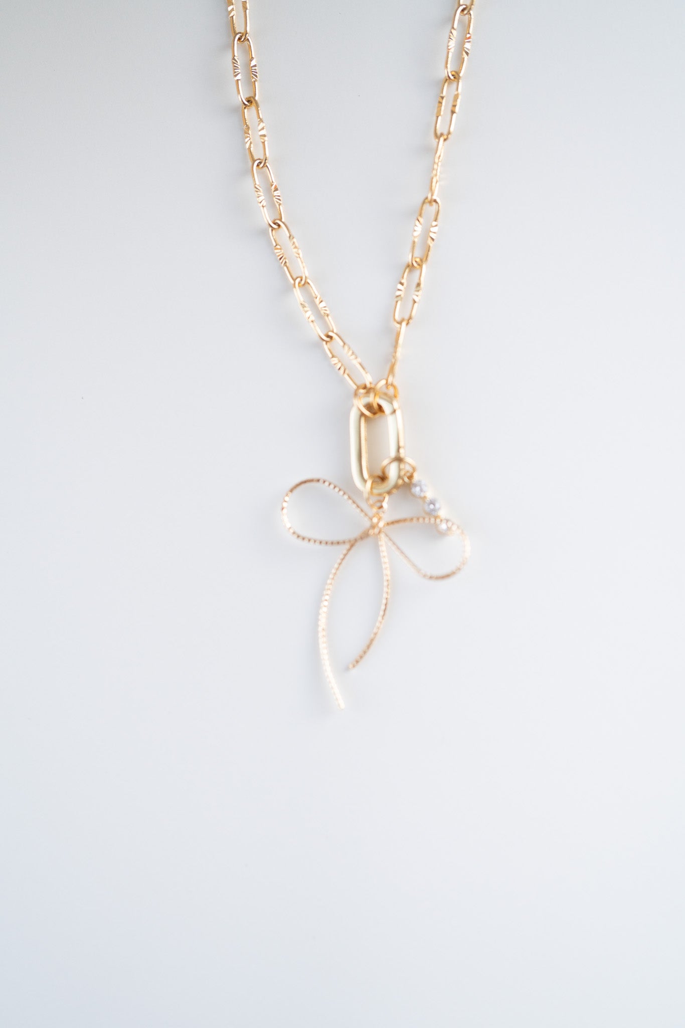 Golden Bow Luxe Charm Necklace