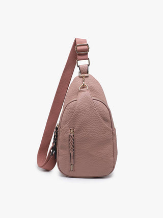 Blush pink pebbled leather sling backpack purse with adjustable crossbody strap and front zip pocket.