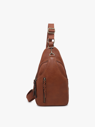 Cognac brown pebbled leather sling backpack purse with adjustable crossbody strap and front zip pocket.